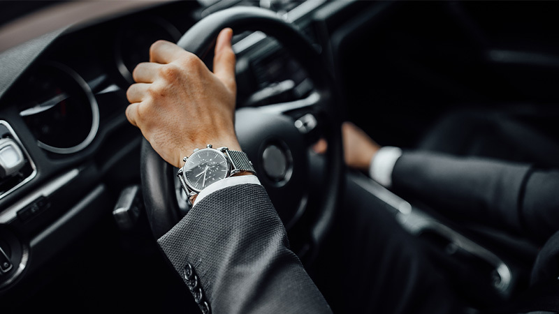 Hands on a steering wheel