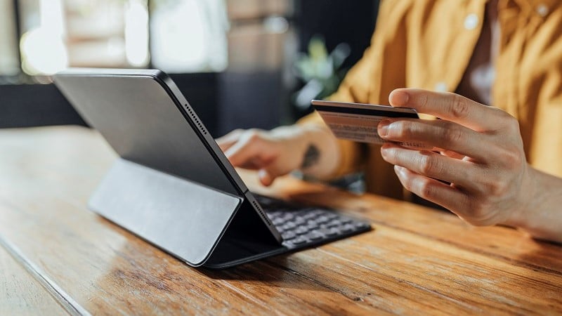 Man sitting at home and shopping online.