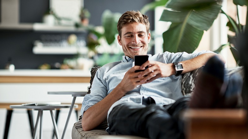 Young man using his mobile phone