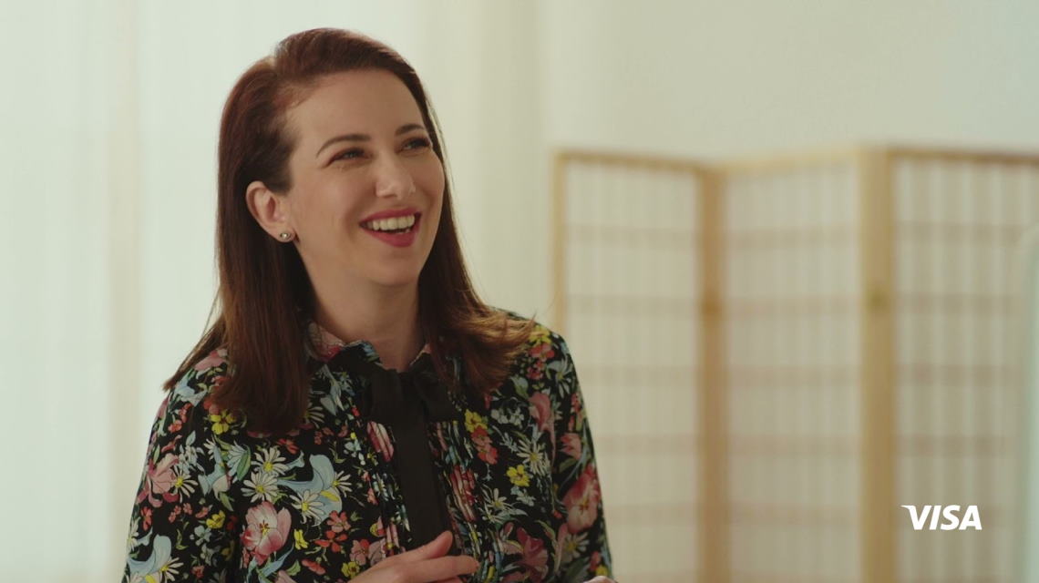 a girl wearing a floral shirt