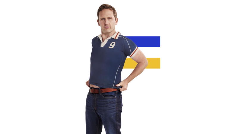 Romanian man wearing a football shirt