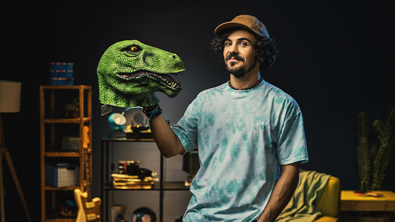 a man with a dinosaur head