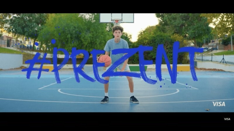 boy playing basketball on a court