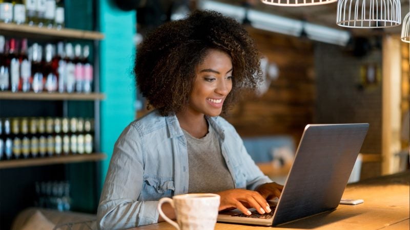 Person sitting at desk using laptop