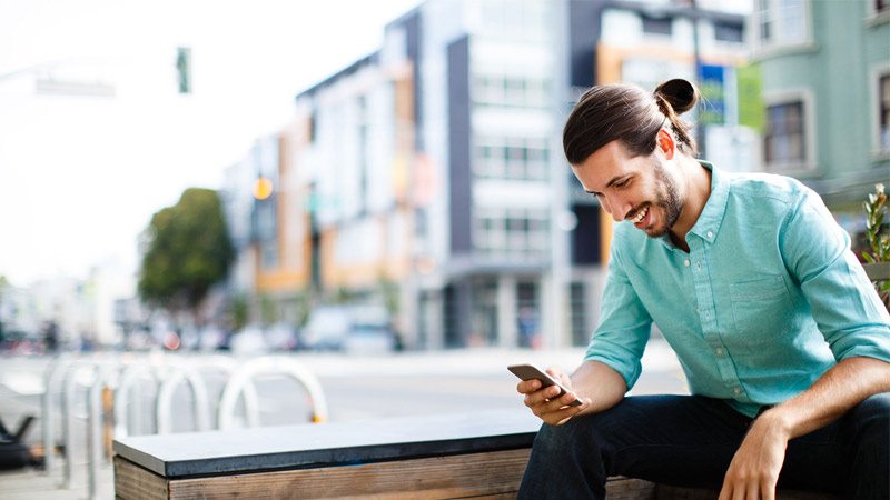 going-digital-800x450 Person sitting using phone